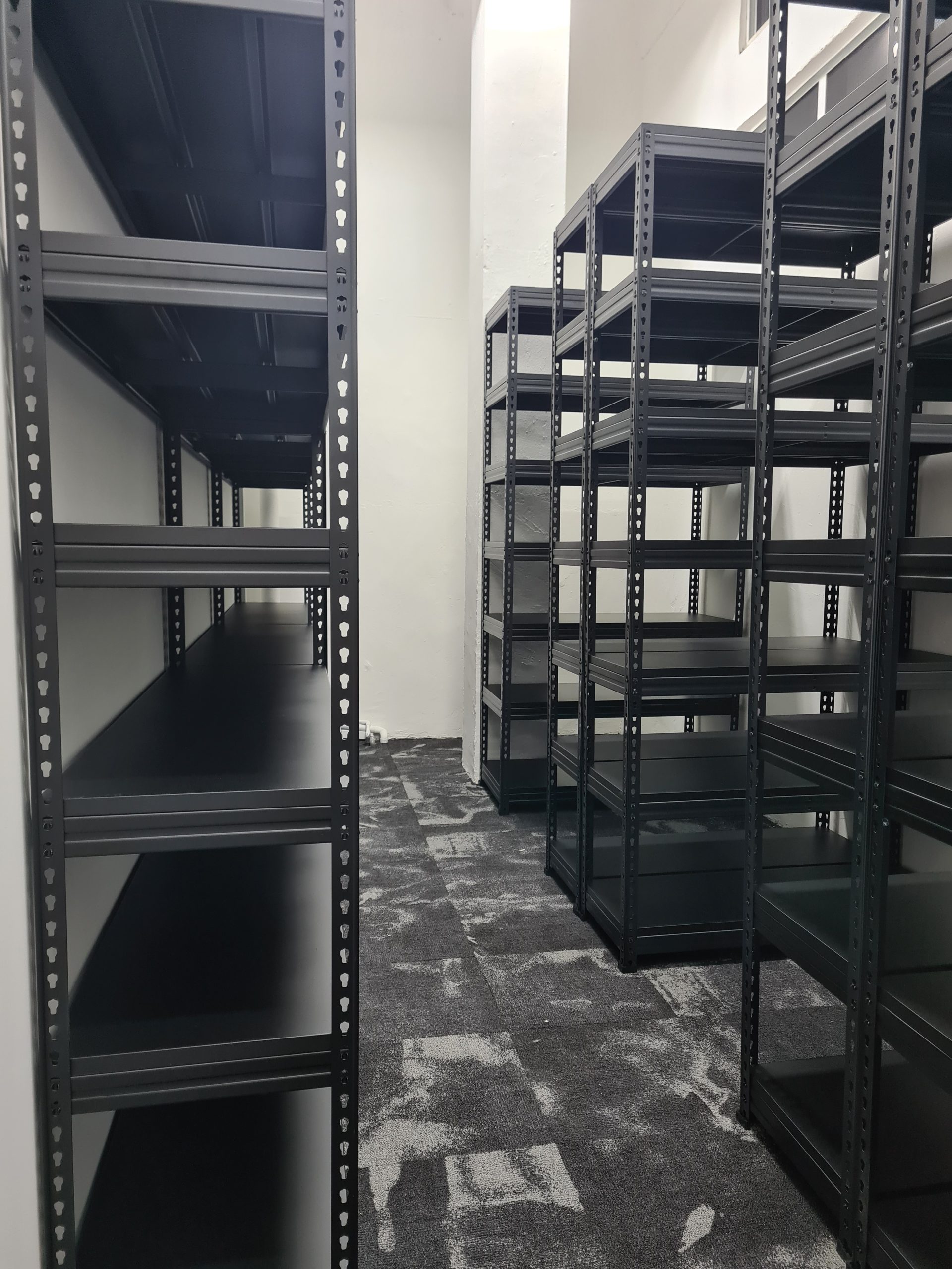 5-tier boltless storage rack in HDB bomb shelter.